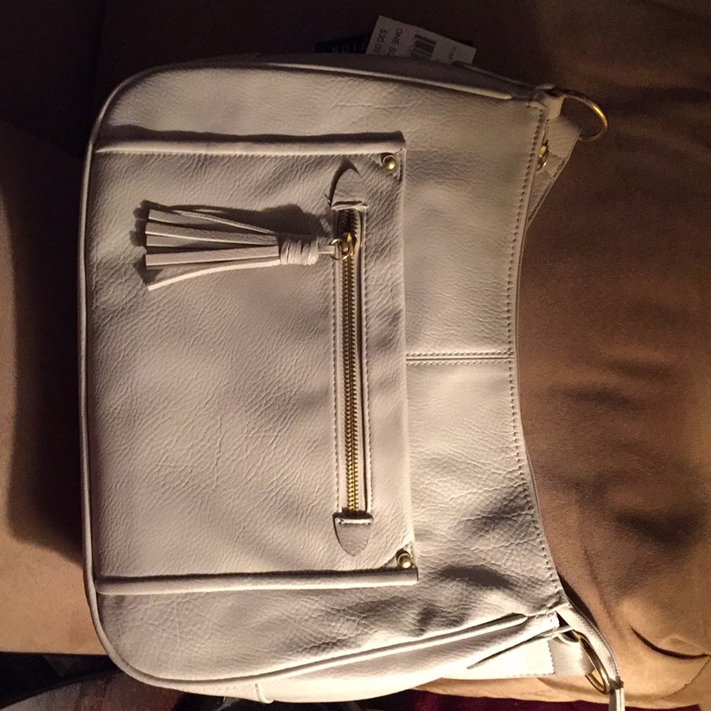 Hobo purse with a tassel zipper.